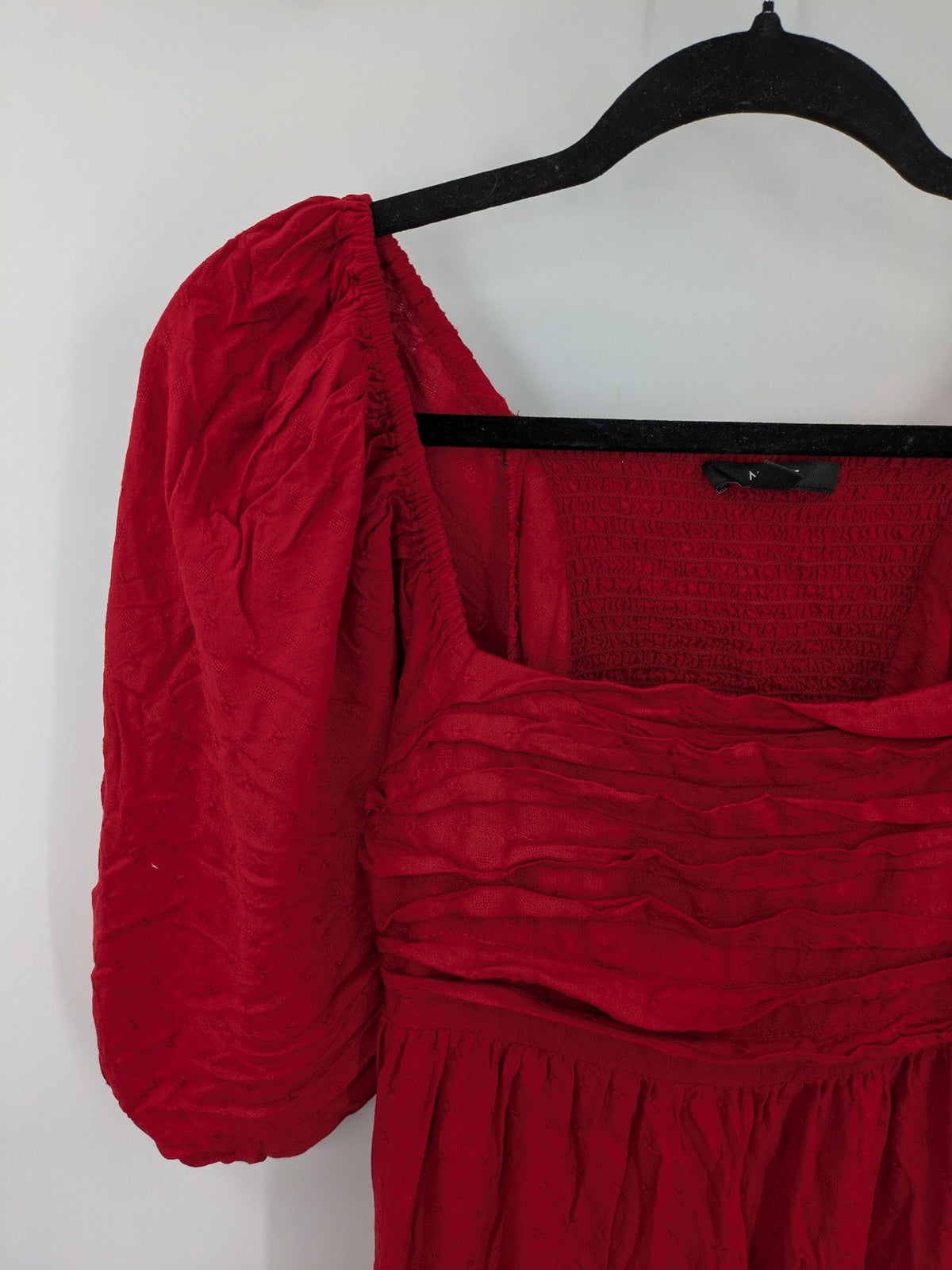 NEXT red midi dress with puff sleeves, smocked bodice, and stylish back cut-out.