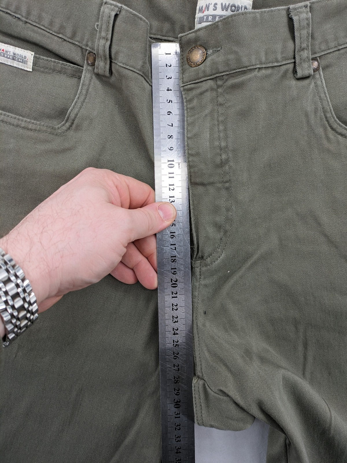 Man's World khaki chino pants with button and zipper closure, made from cotton-elastane blend.
