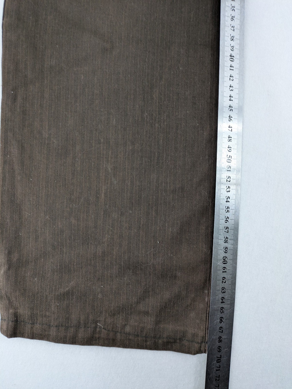Authentic Clothing Company brown straight jeans with subtle stripe pattern and brand patch.