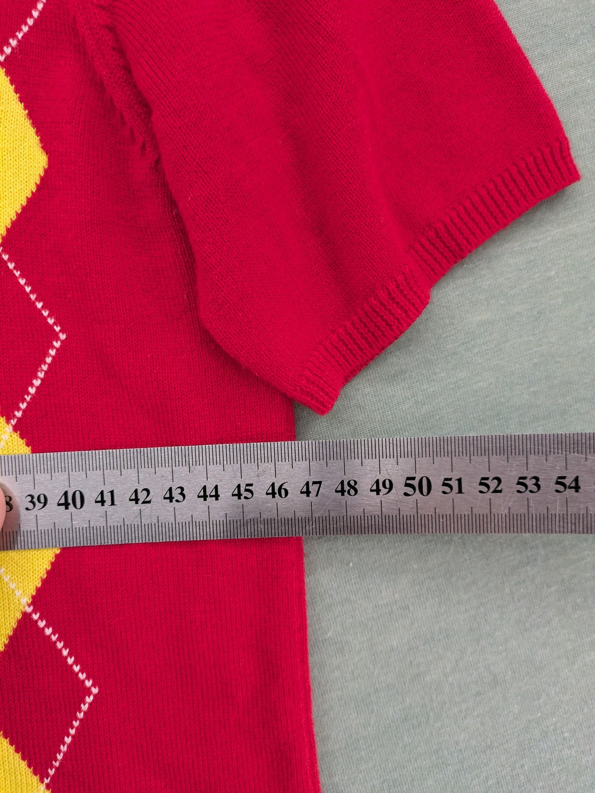 MAYSER multi turtle neck jumper argyle pattern in red, yellow, and black cotton.