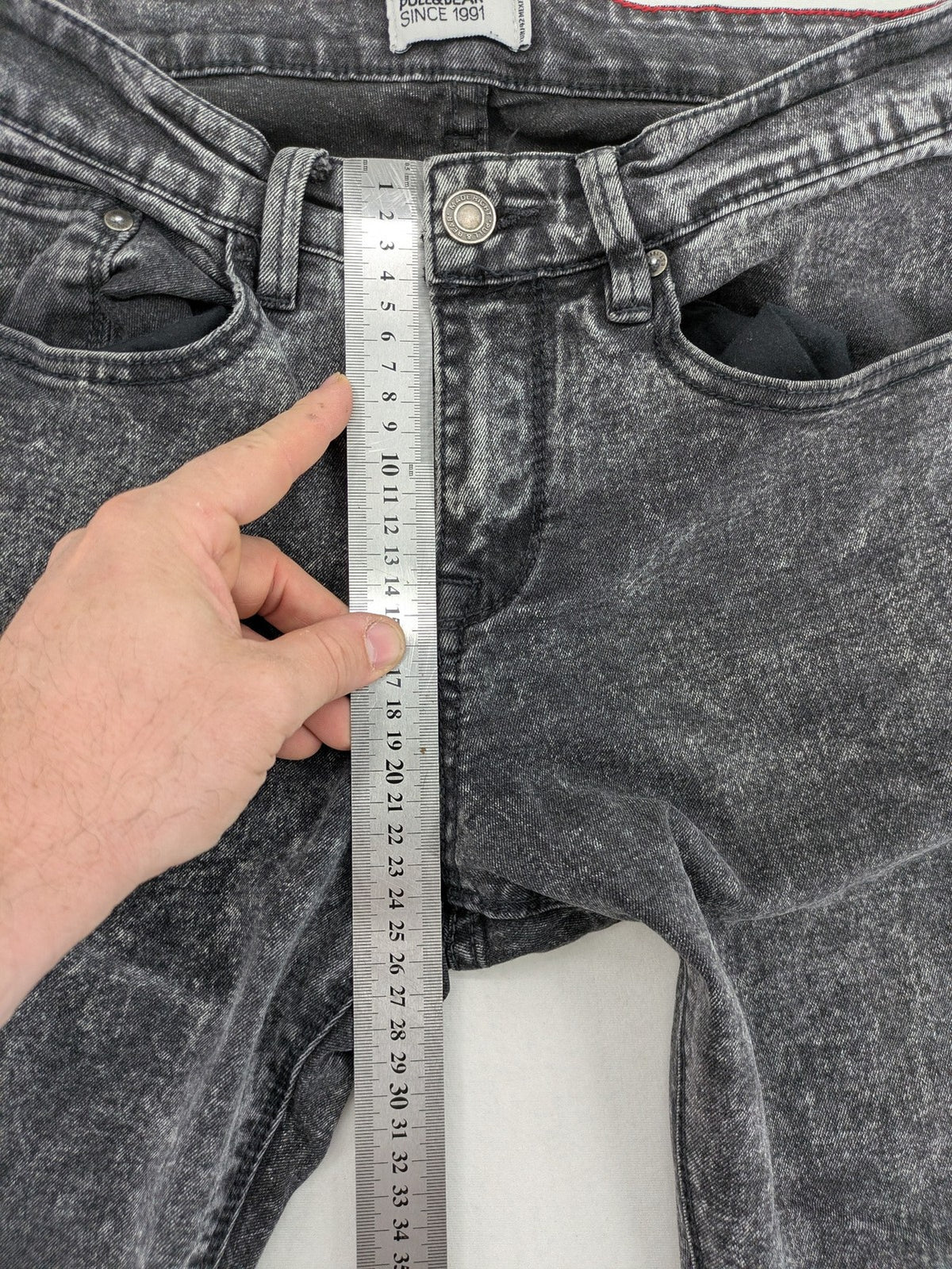 Pull&Bear black acid wash straight jeans slim fit with faded denim texture.