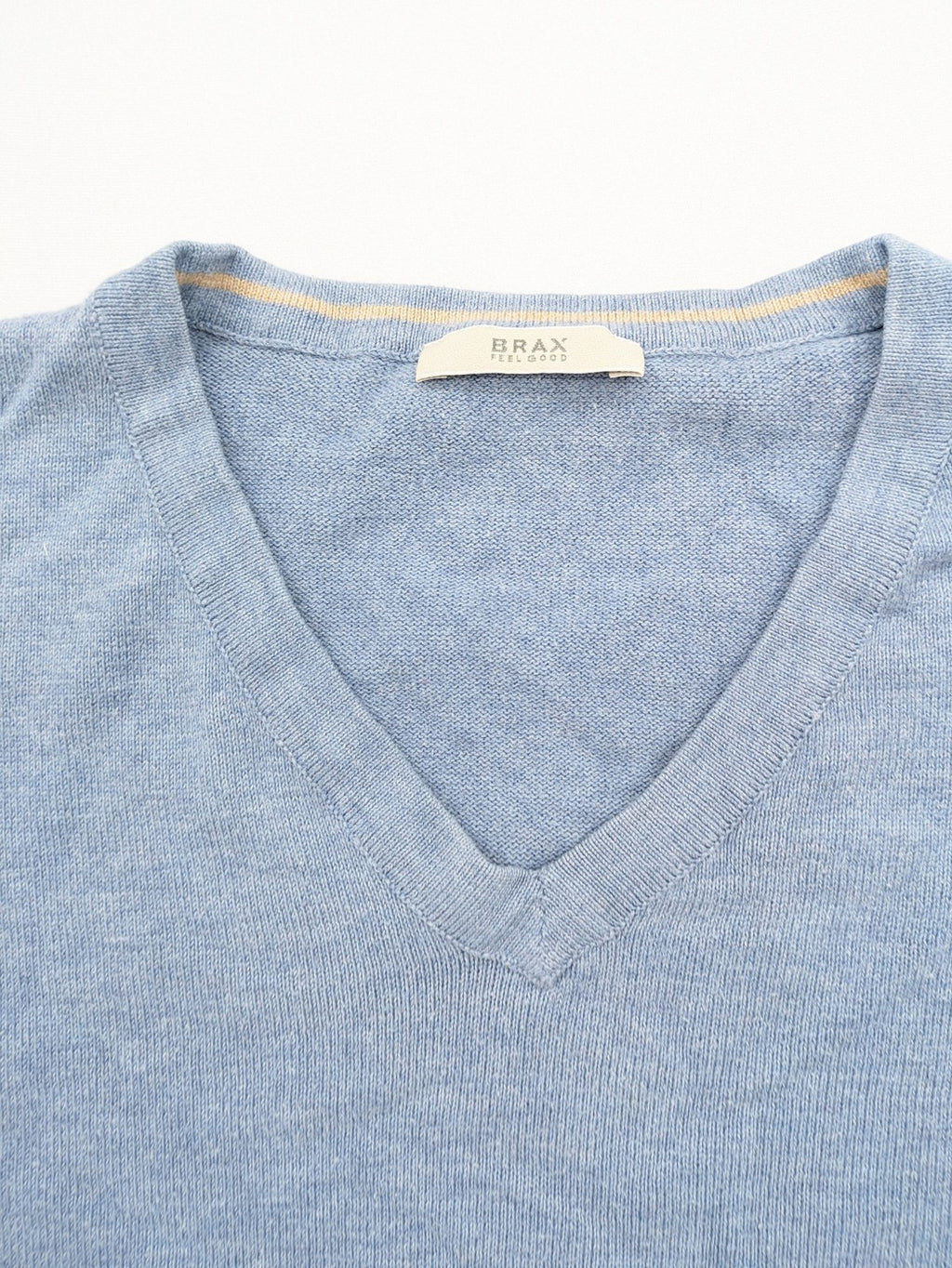 BRAX blue turtle neck jumper with V-neck and subtle "X" logo embroidery.