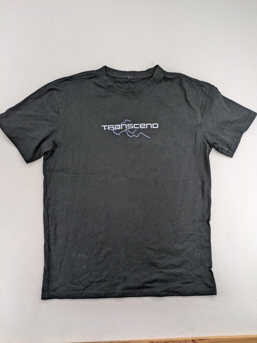 Transcend multi graphic t-shirt black cotton "Go Beyond The Limits" print on back.