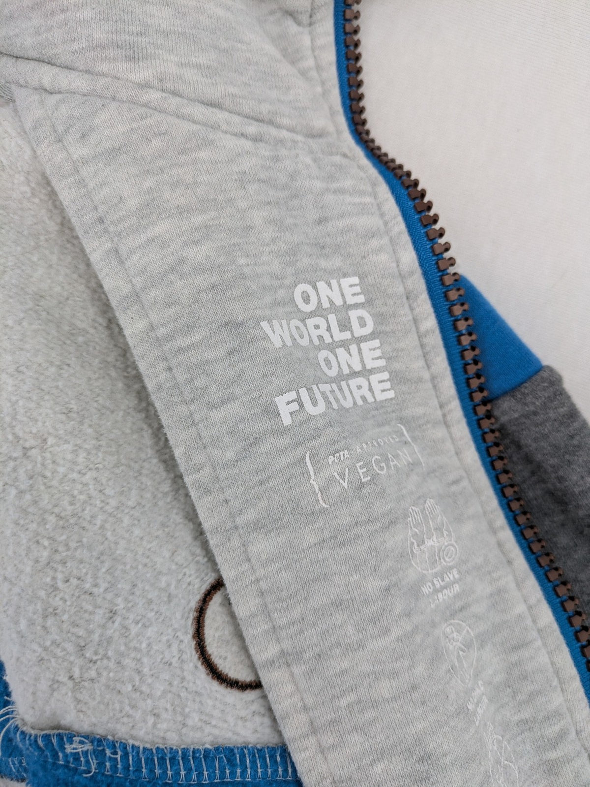 ALIFE turtle neck jumper blue grey colorblock design with logo details and soft cotton blend.