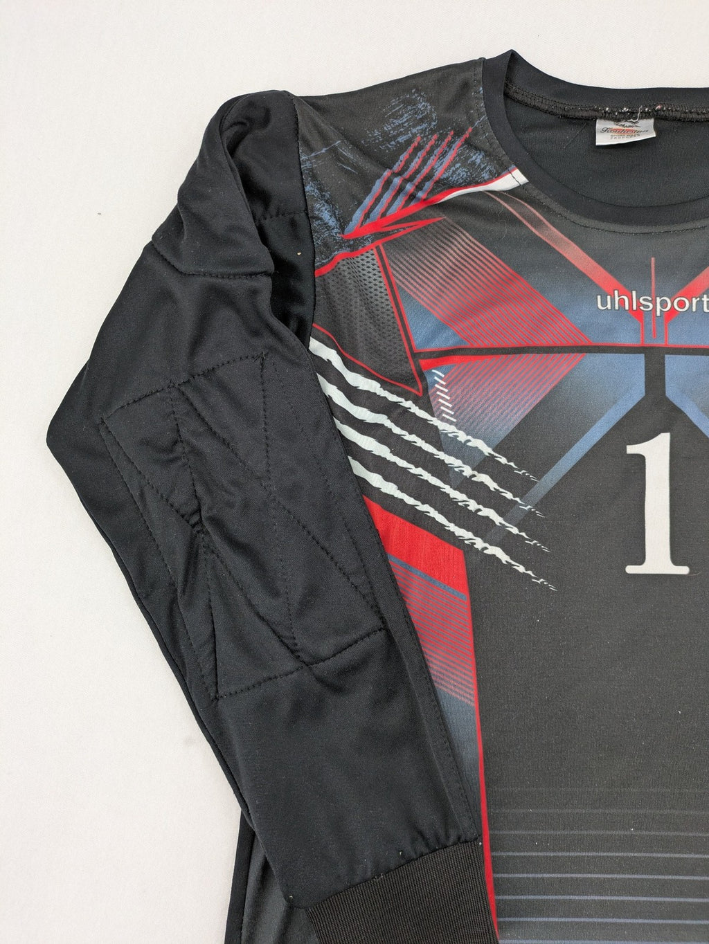 uhlsport long sleeve goalkeeper jersey black with red and blue accents, padded elbows, number 1