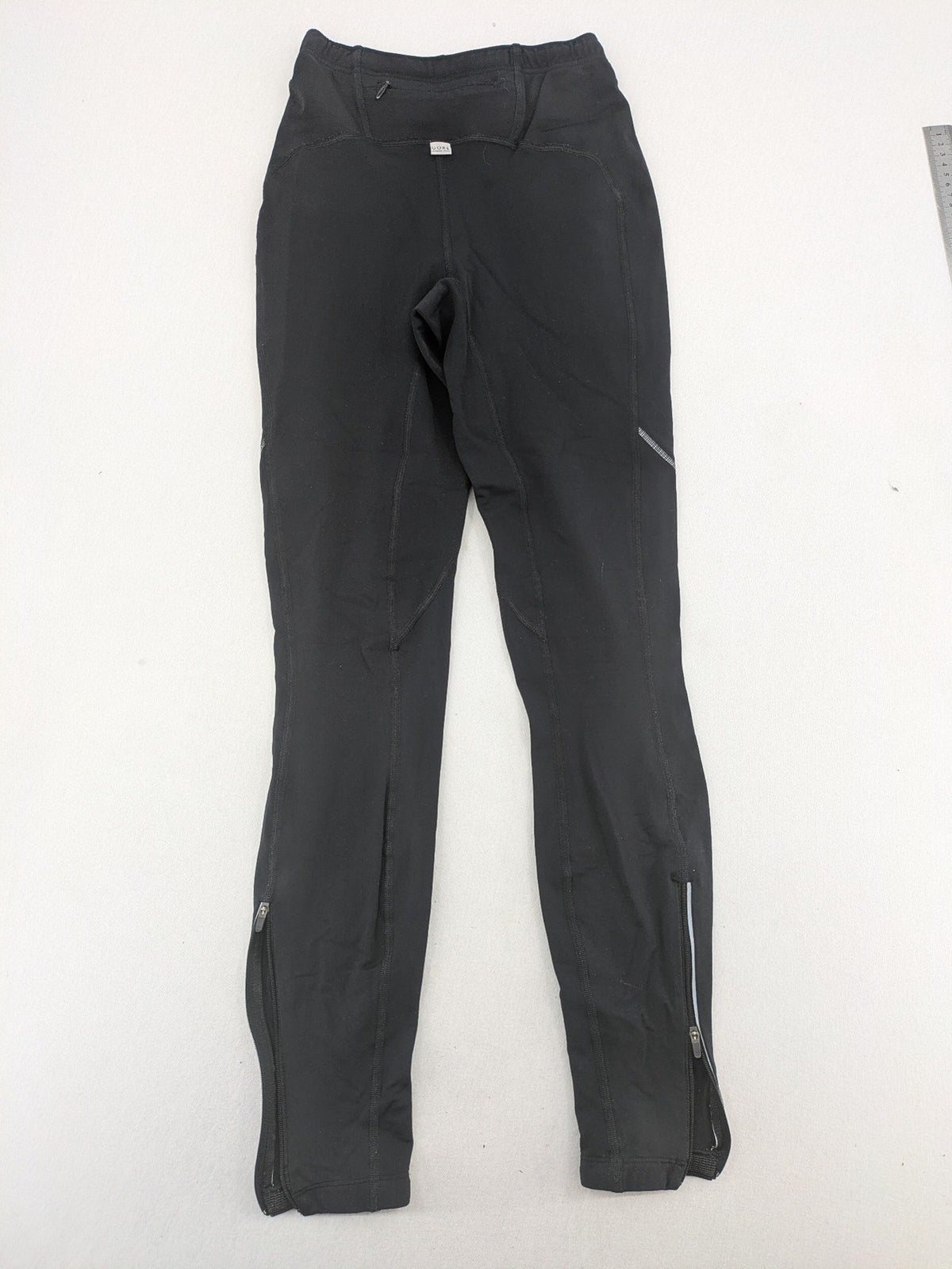 GORE RUNNING WEAR black bicycle tights with reflective details and zippered ankle openings.