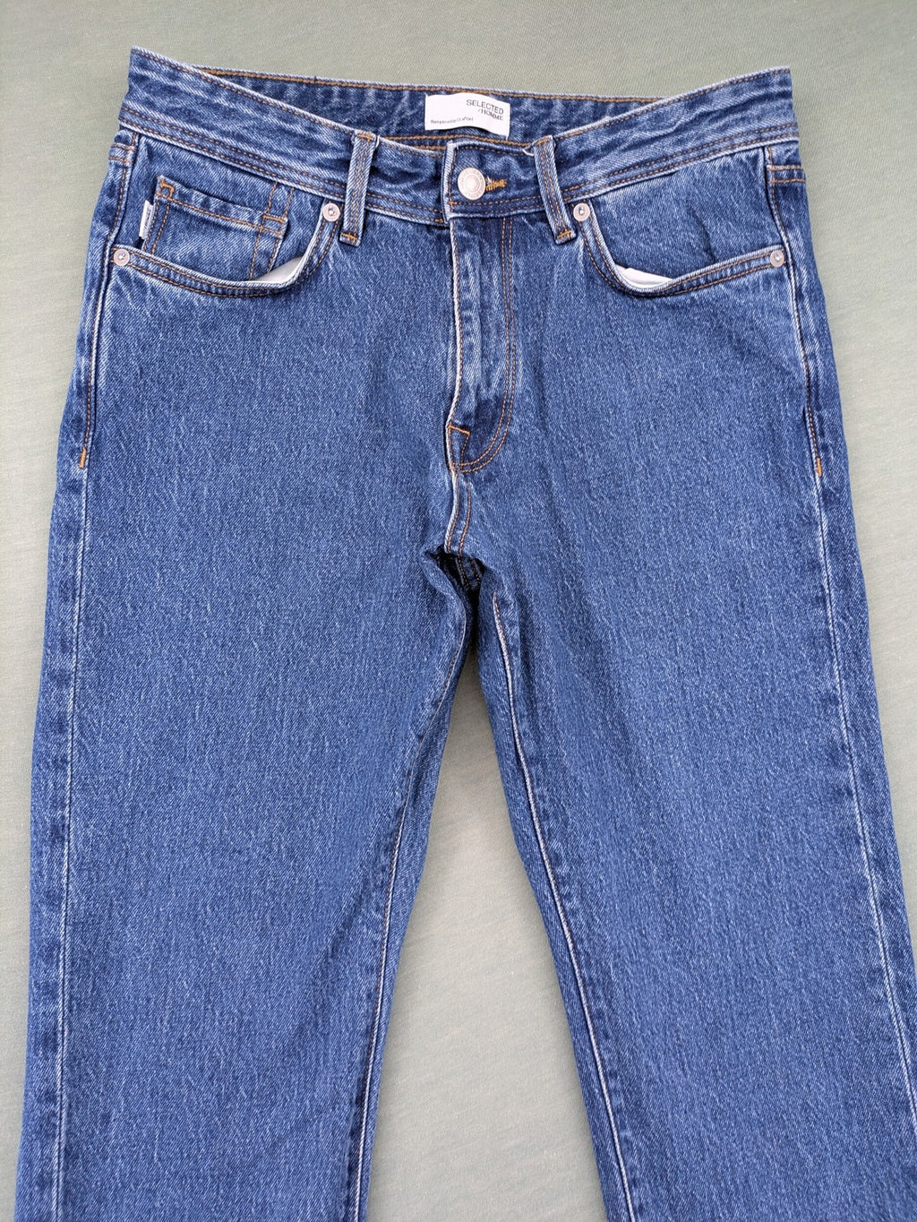 Selected Homme blue straight fit jeans with classic five-pocket design and medium wash denim.