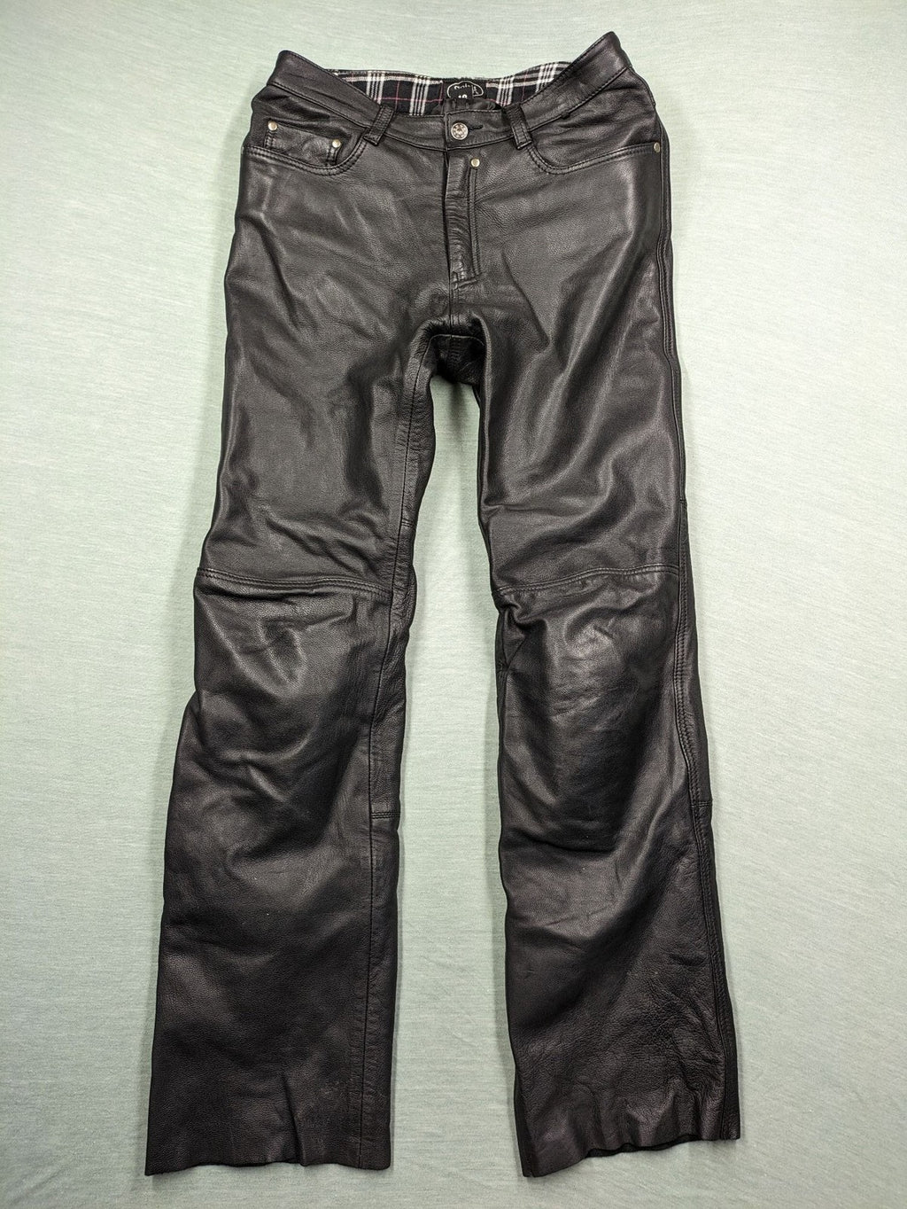 Spirit Motors black leather chaps with red and white accents, 5-pocket style, reinforced knees.
