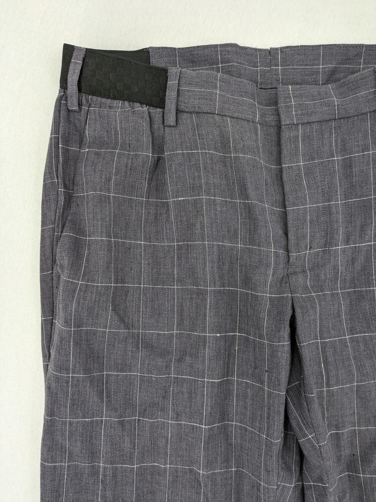 MNG Man grey plaid pants with rolled hem and stretch performance material.