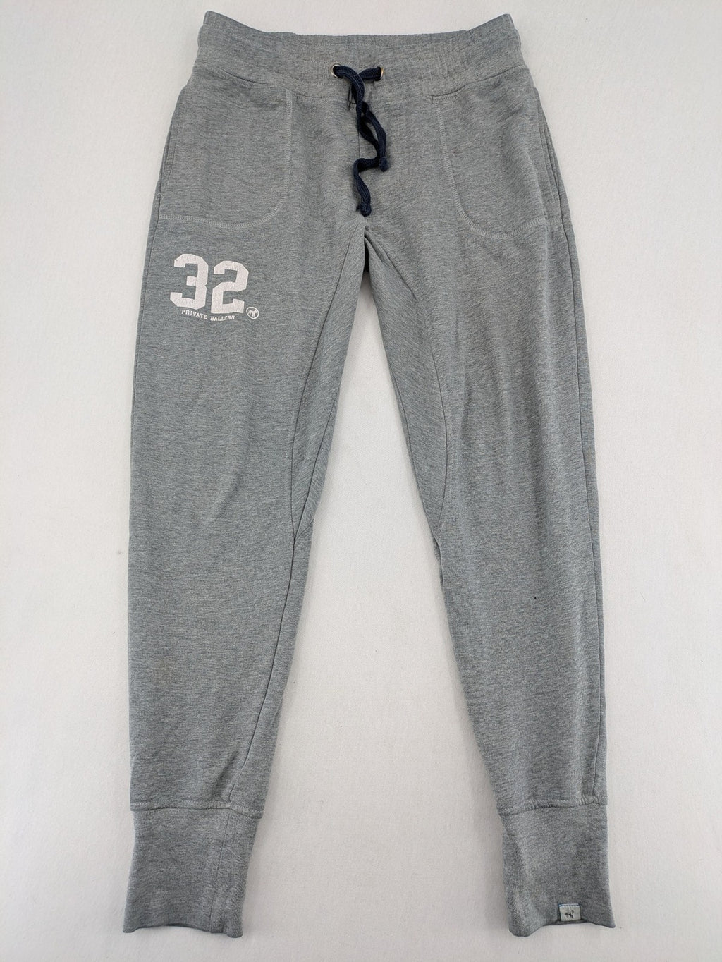 Private Baller grey sweatpants with "32" graphic print and blue drawstring.