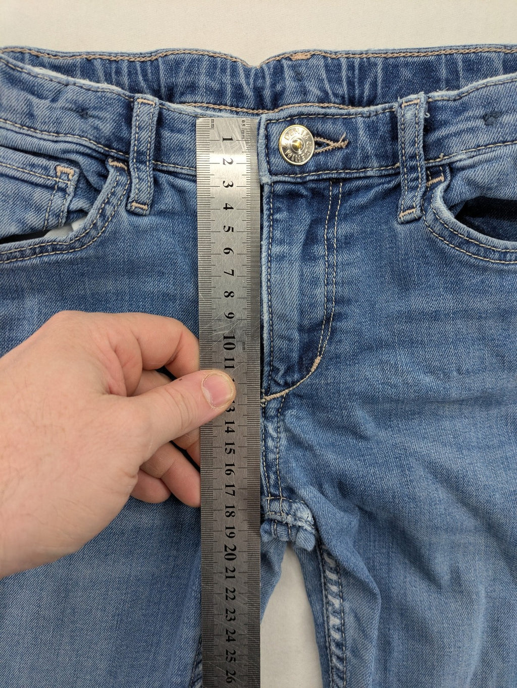 H&M blue bootcut jeans size 146, medium wash, stretch denim material.
