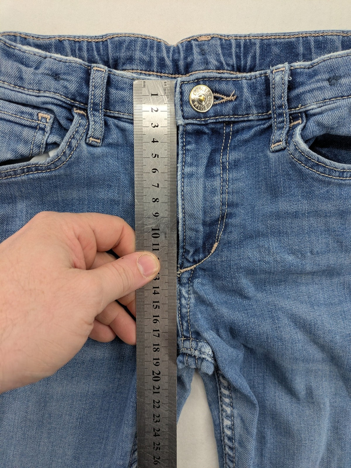 H&M blue bootcut jeans size 146, medium wash, stretch denim material.