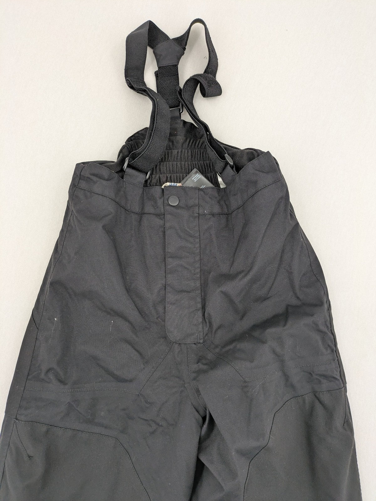 H&M grey snow overalls with adjustable straps and front zipper, durable winter wear.