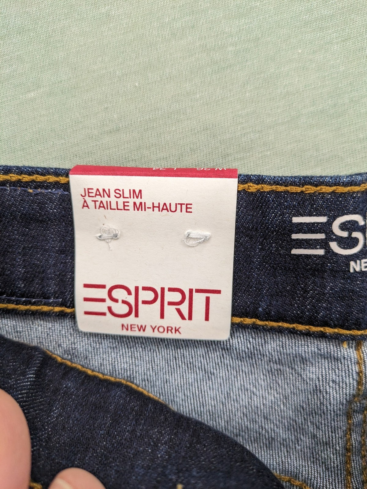 Esprit navy straight jeans with five-pocket style and yellow contrast stitching.