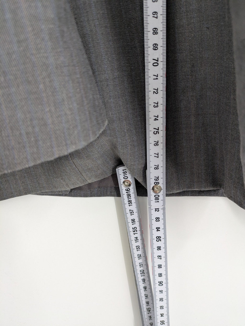 Alextrading grey jacket with subtle light blue pinstripe pattern and notch lapels.