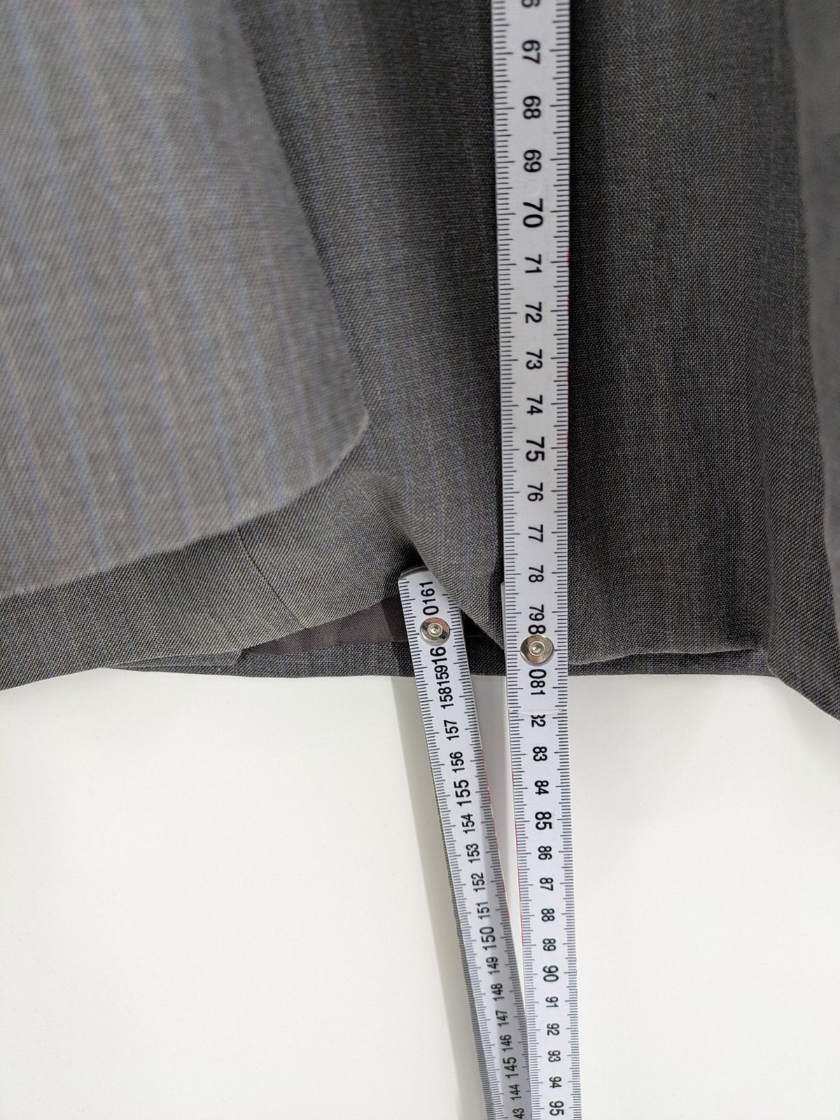Alextrading grey jacket with subtle light blue pinstripe pattern and notch lapels.