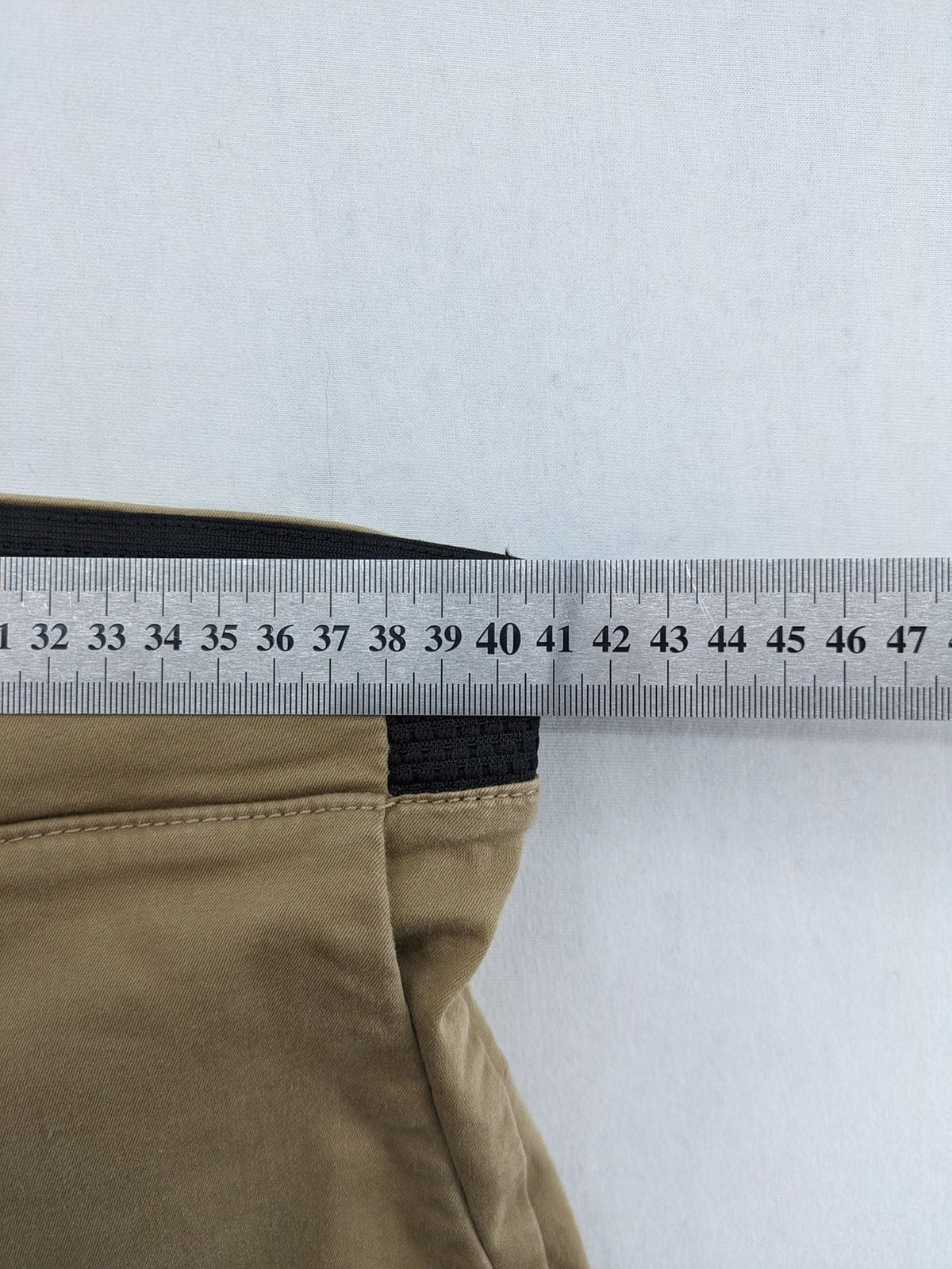 Zara khaki pants with elastic waistband, made from stretch cotton blend for comfort.