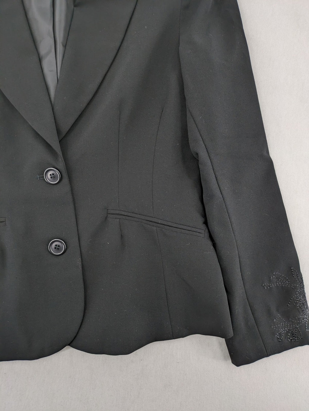 Lindex black blazer coat two-button design with subtle embroidery and tailored silhouette.