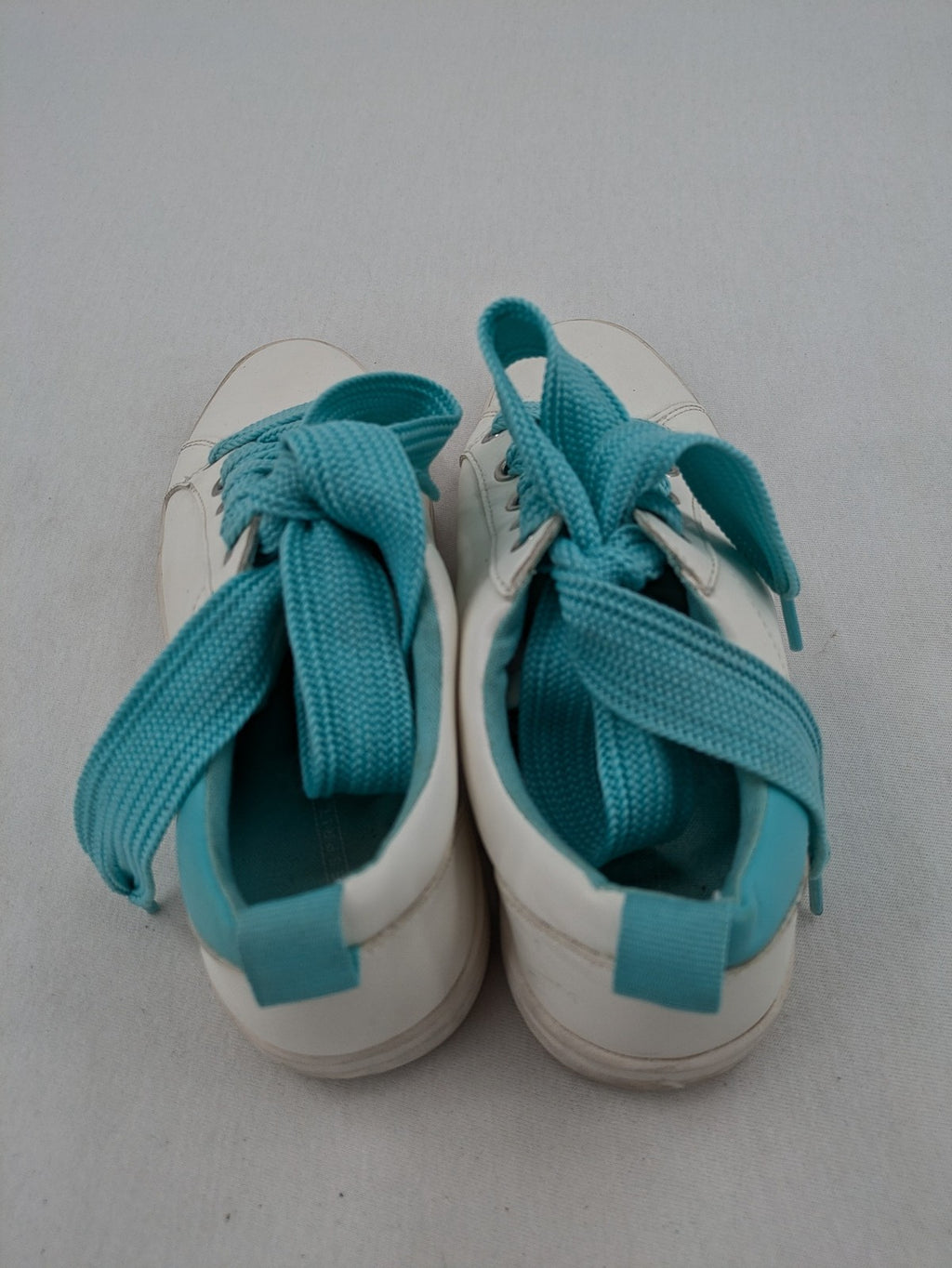 Esprit women's sneakers white with turquoise accents and wide laces.