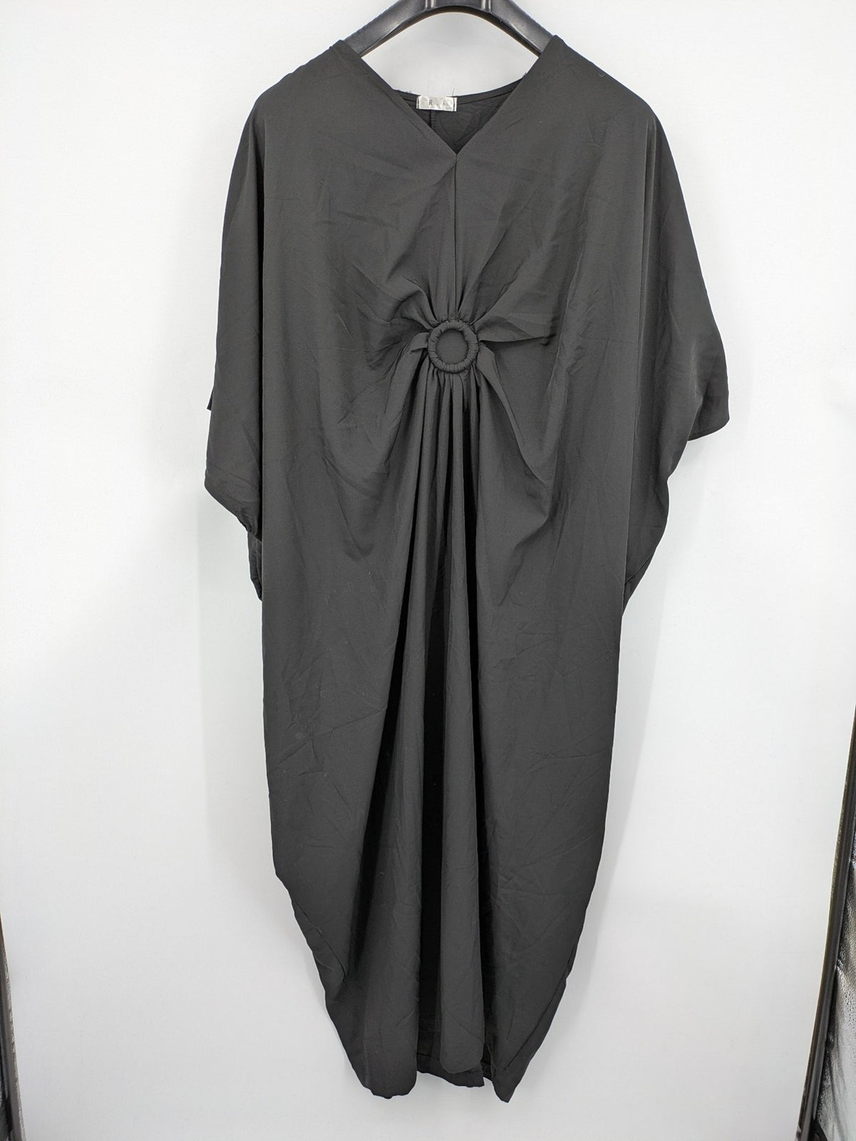 R.R grey kaftan dress with V-neck, oversized fit, and central ring detail.