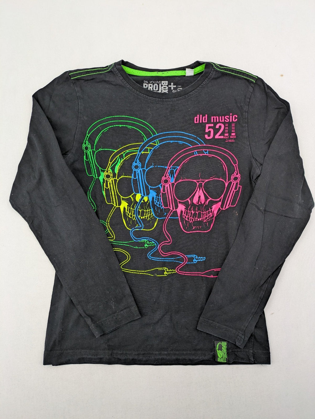 here there pink long sleeve shirt neon skull graphic with headphones and green contrast stitching
