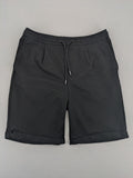Zara black shorts with elastic drawstring, pleats, and rolled hem detail.