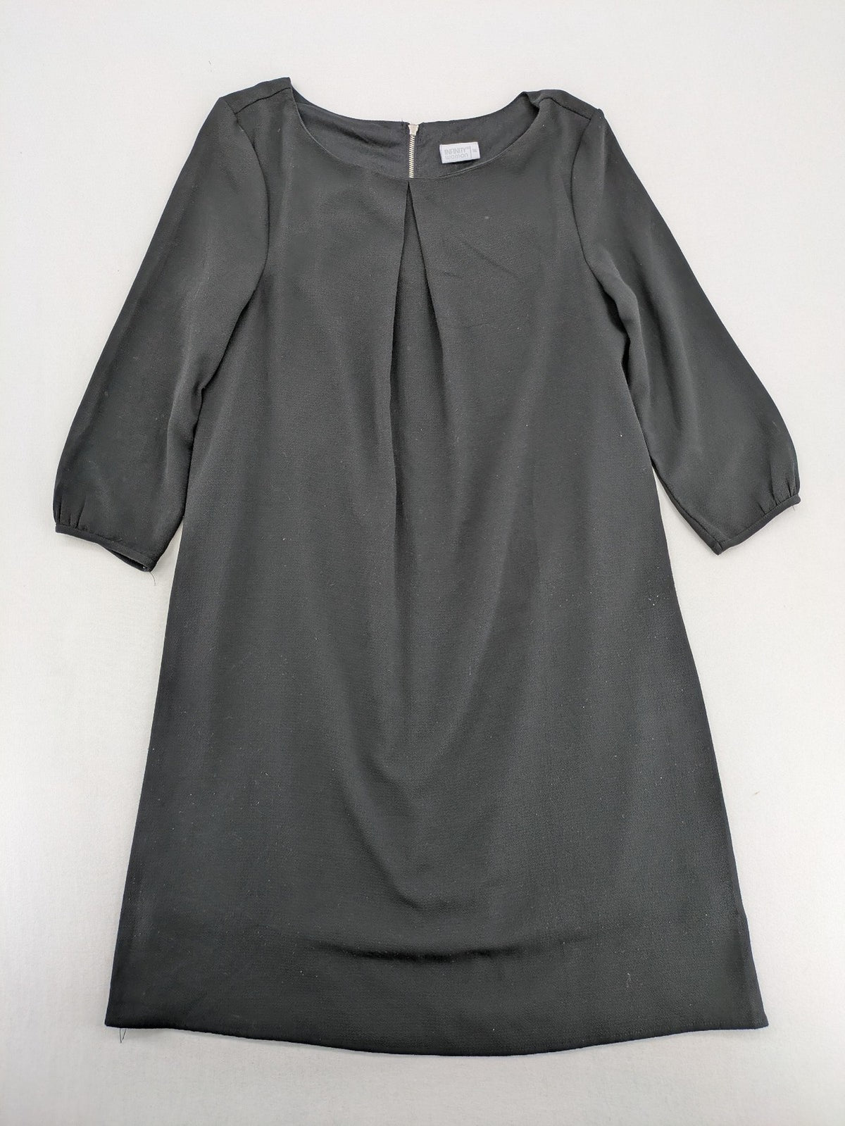 Infinity grey bridal party dress with pleated front and 3/4 sleeves.