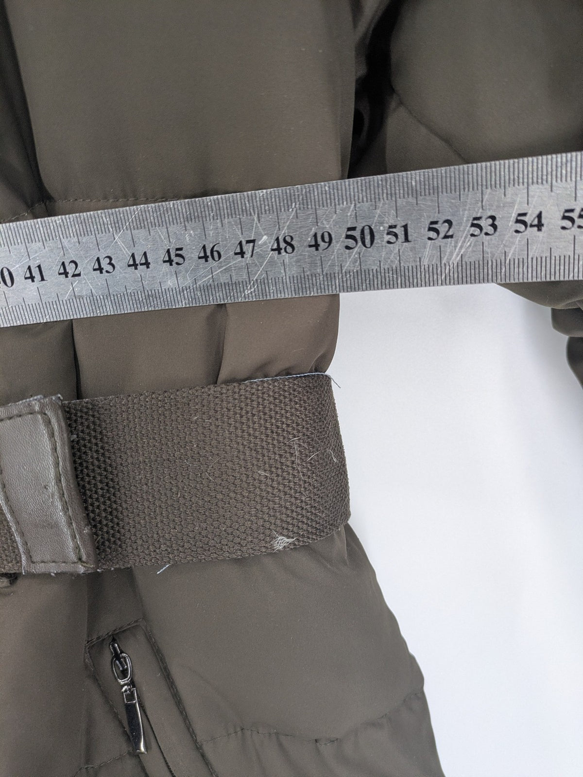 Yessica khaki puffer coat long quilted design with belt, zip pockets, and hood.