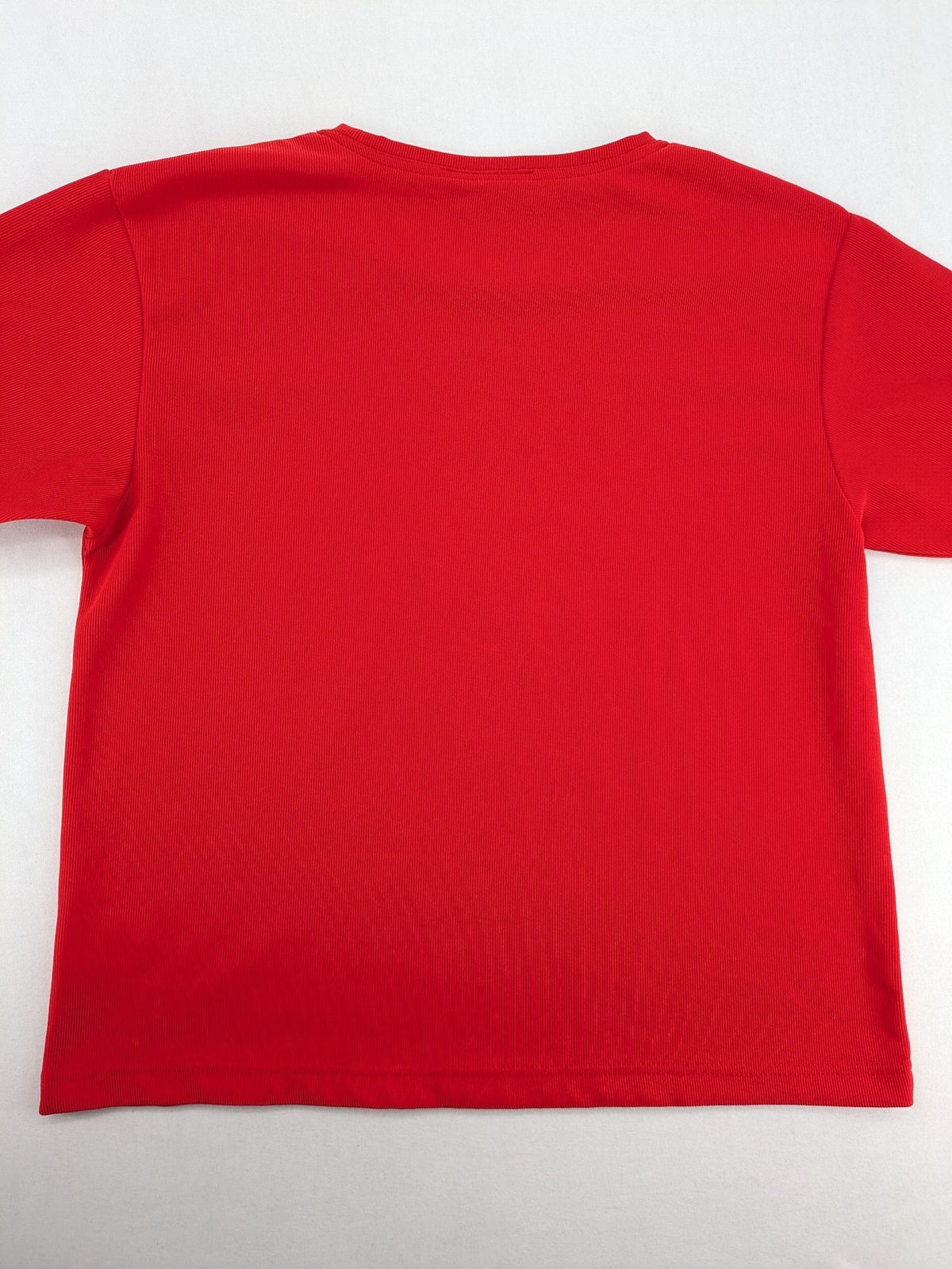 Hajo red t-shirt with ribbed texture and rhinestone Y-logo on chest.