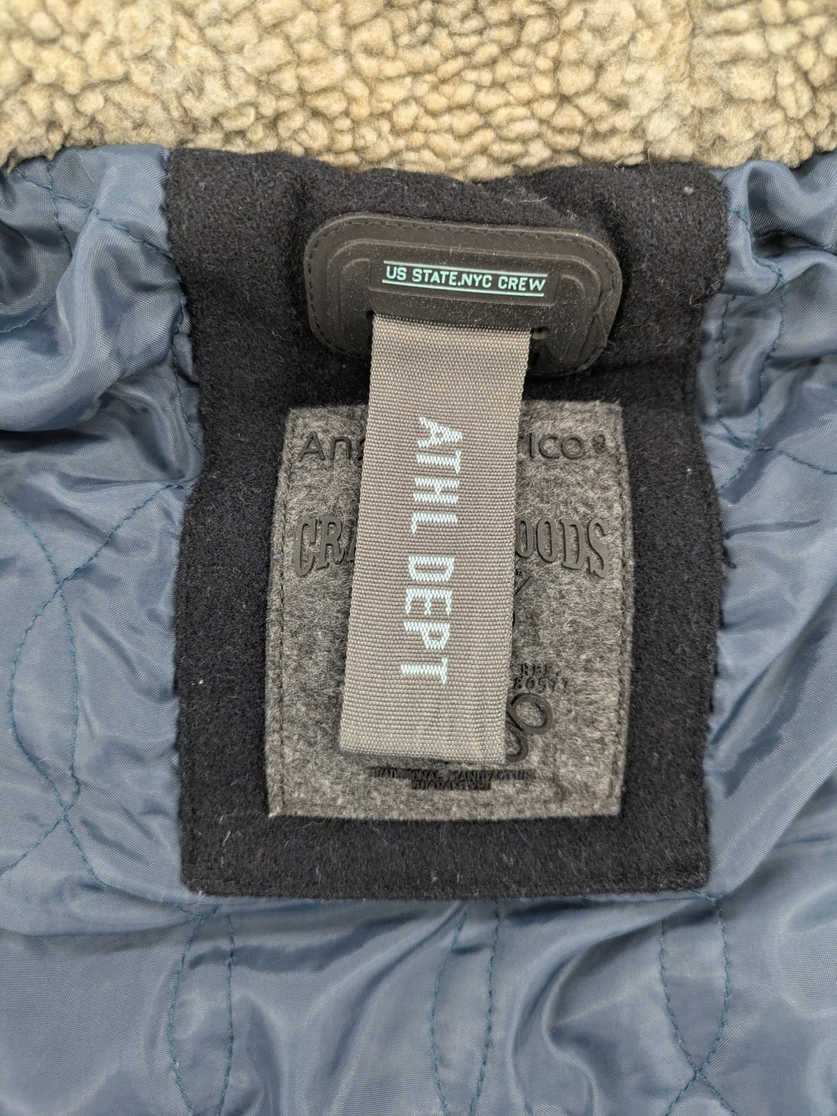 Angelo Litrico black duffle coat with toggle closure and cream Sherpa-lined hood.