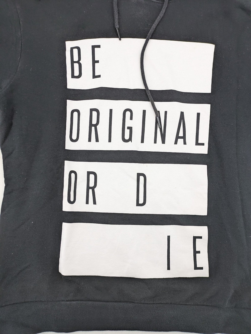 FSBN black hoodie with "BE ORIGINAL OR DIE" graphic print, slim fit, cotton-polyester blend.