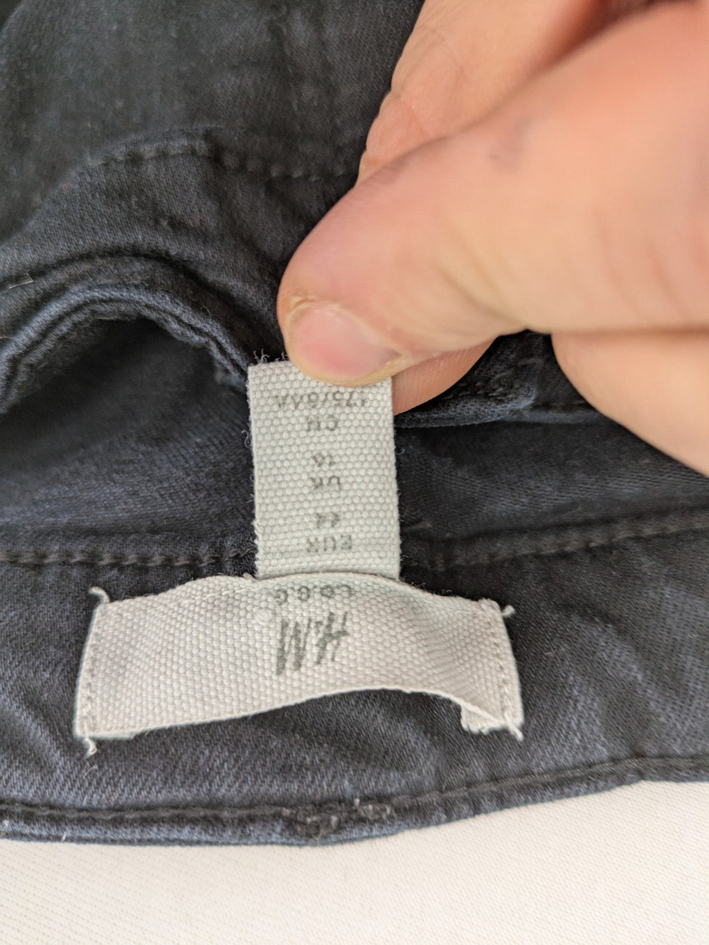 H&M grey skinny jeans with faded wash and soft stretch denim material.