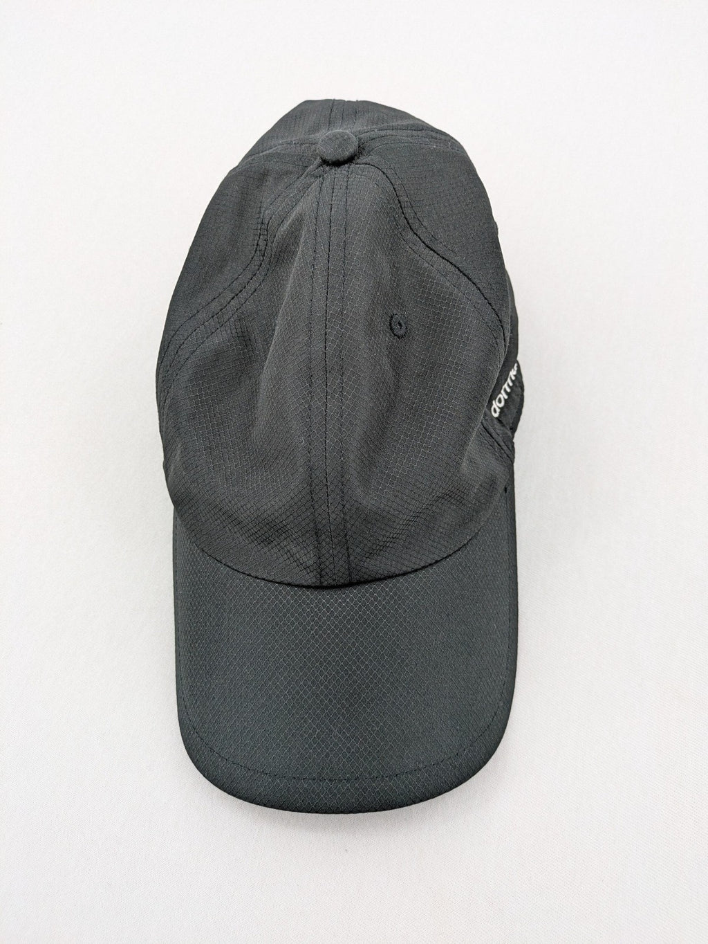 Dormakaba grey baseball cap 6-panel design with white embroidered logo and adjustable strapback.