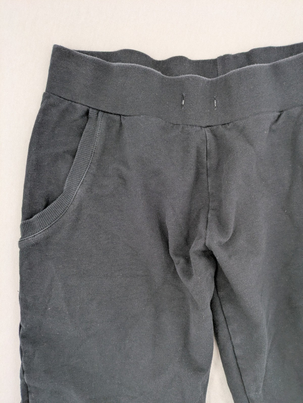 Manguun Sports grey jogger pants soft cotton blend with subtle logo embroidery and elastic waistband.