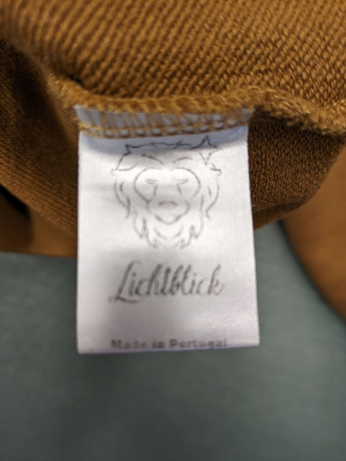 ALS orange crop top sweatshirt with roll neck and embroidered Lichtblick logo.