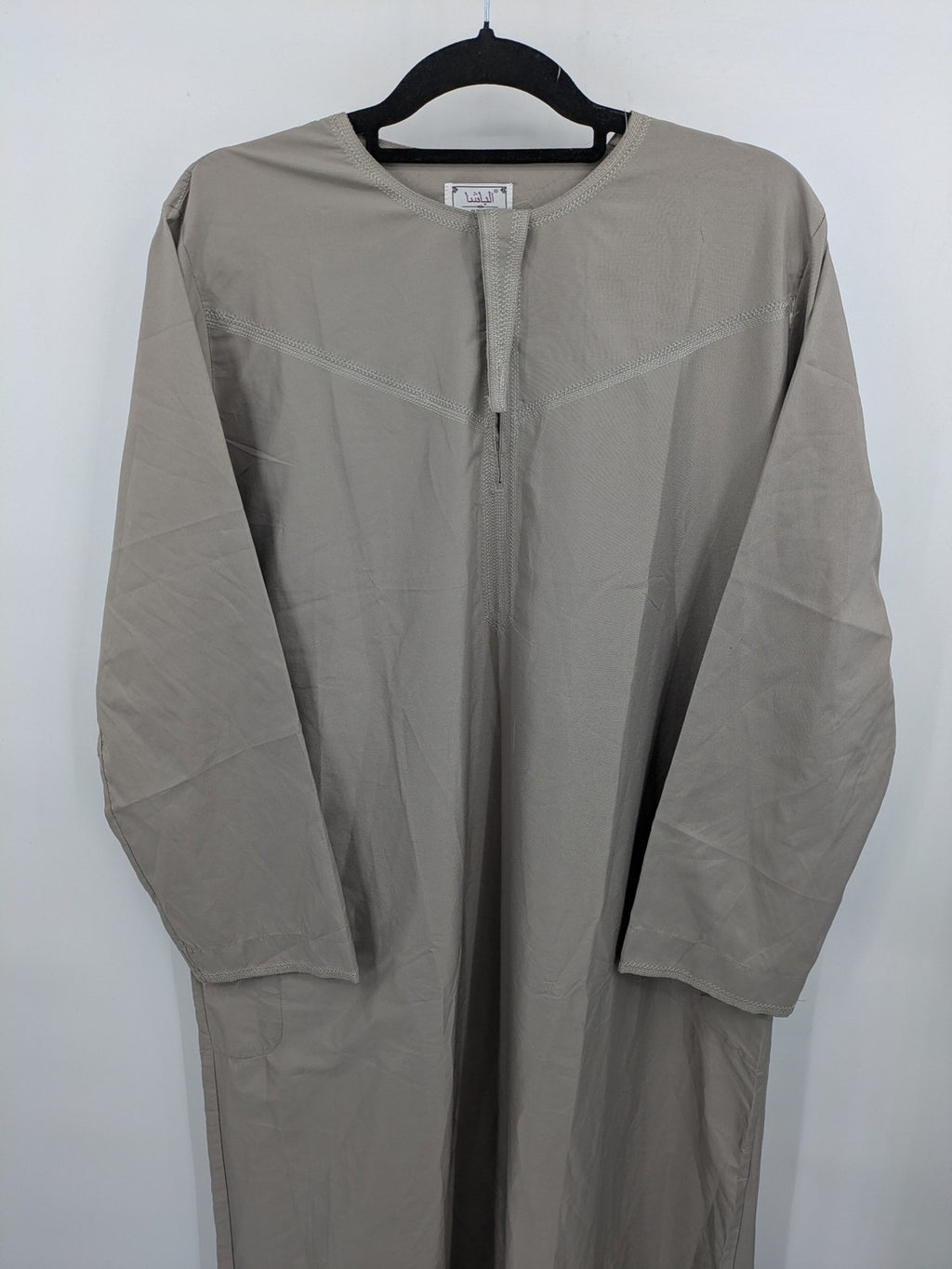 Aleasha beige kaftan thobe long sleeve with subtle embroidery and side pockets.