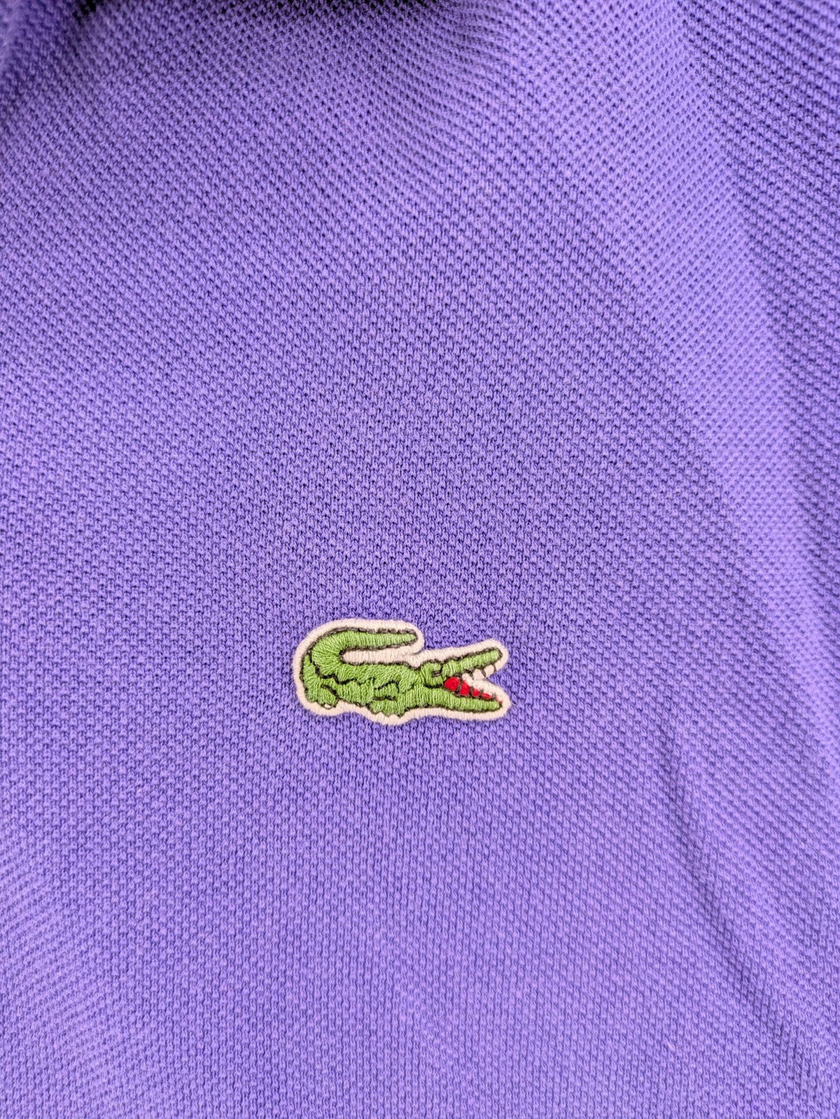 Lacoste purple polo shirt classic fit with embroidered crocodile logo and short sleeves.