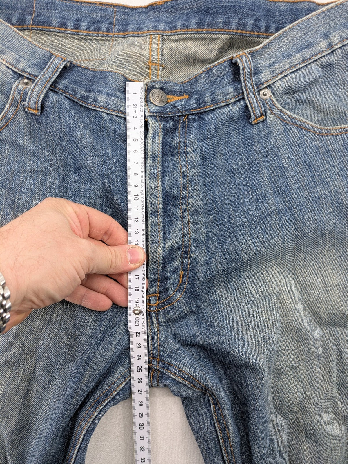 Cheap Monday blue straight jeans with button fly and classic medium wash finish.