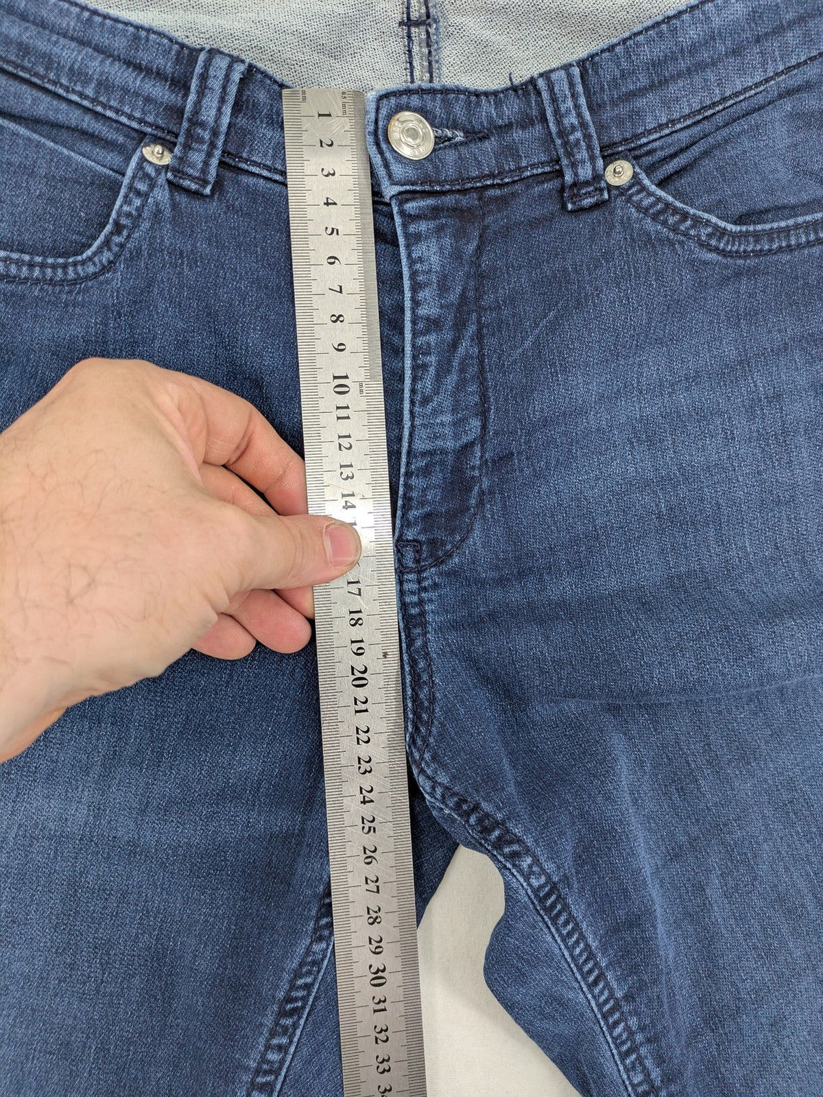 Mac Jeans blue slim fit straight jeans with light wash and stretch material.