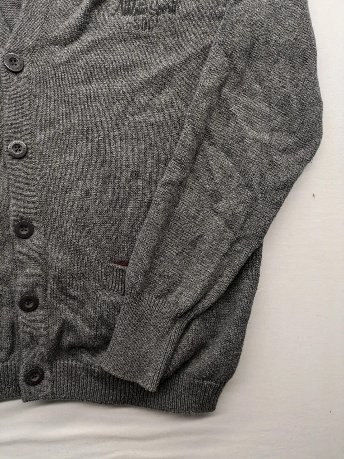 s.Oliver grey turtle neck jumper with varsity college patch and button closure.