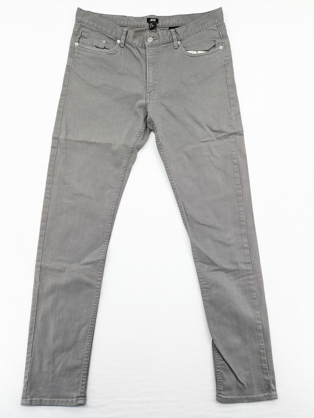 H&M grey skinny fit jeans with button closure and five-pocket design, cotton-elastane blend.