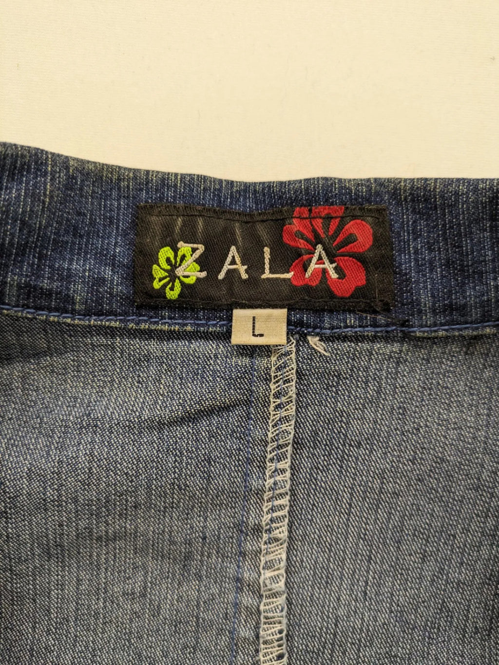Zala blue denim blazer jacket with embroidered details and classic button closure.