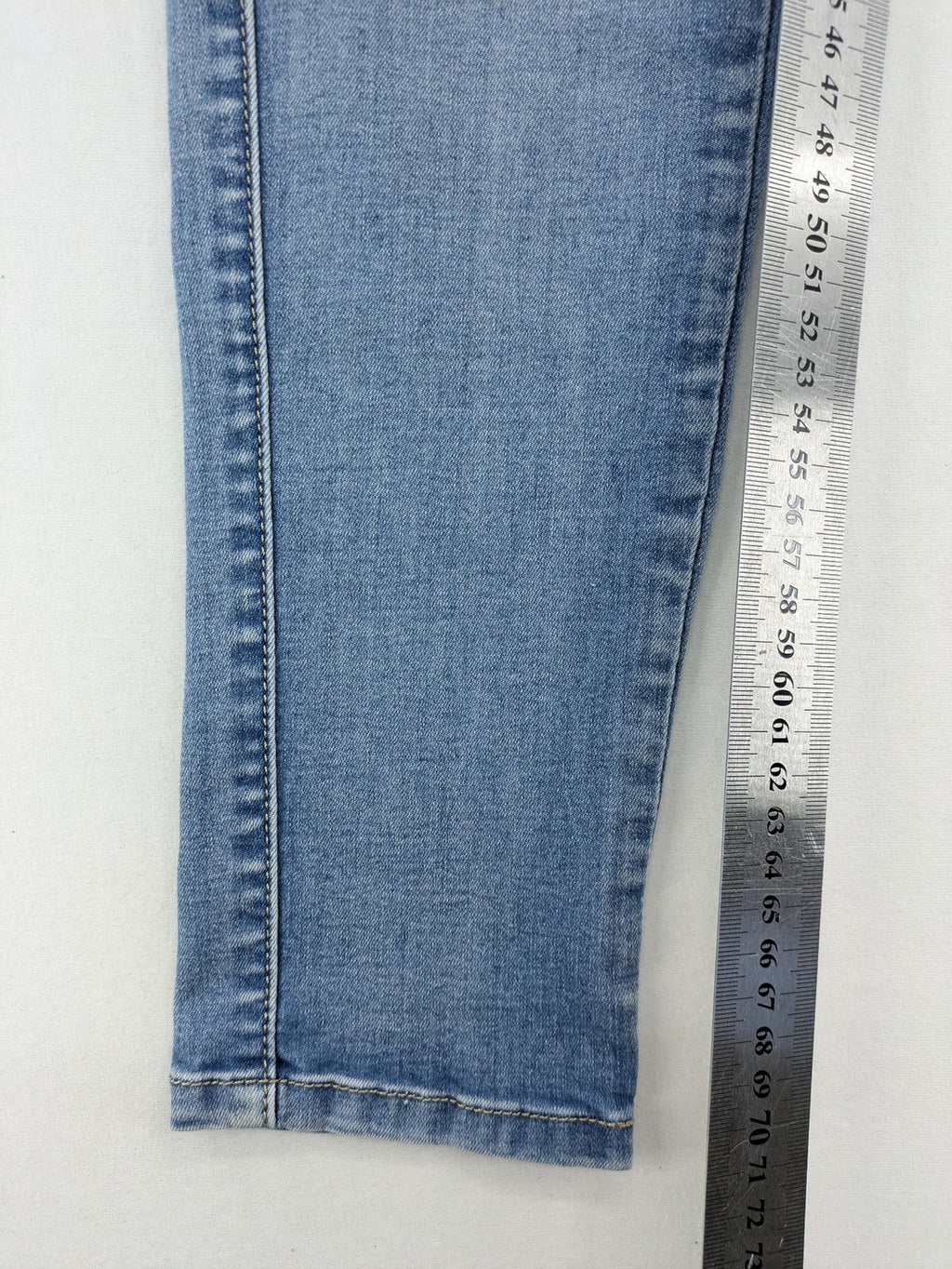 Miss Bonbon blue skinny jeans jeggings with elastic pull-on waistband and light wash.