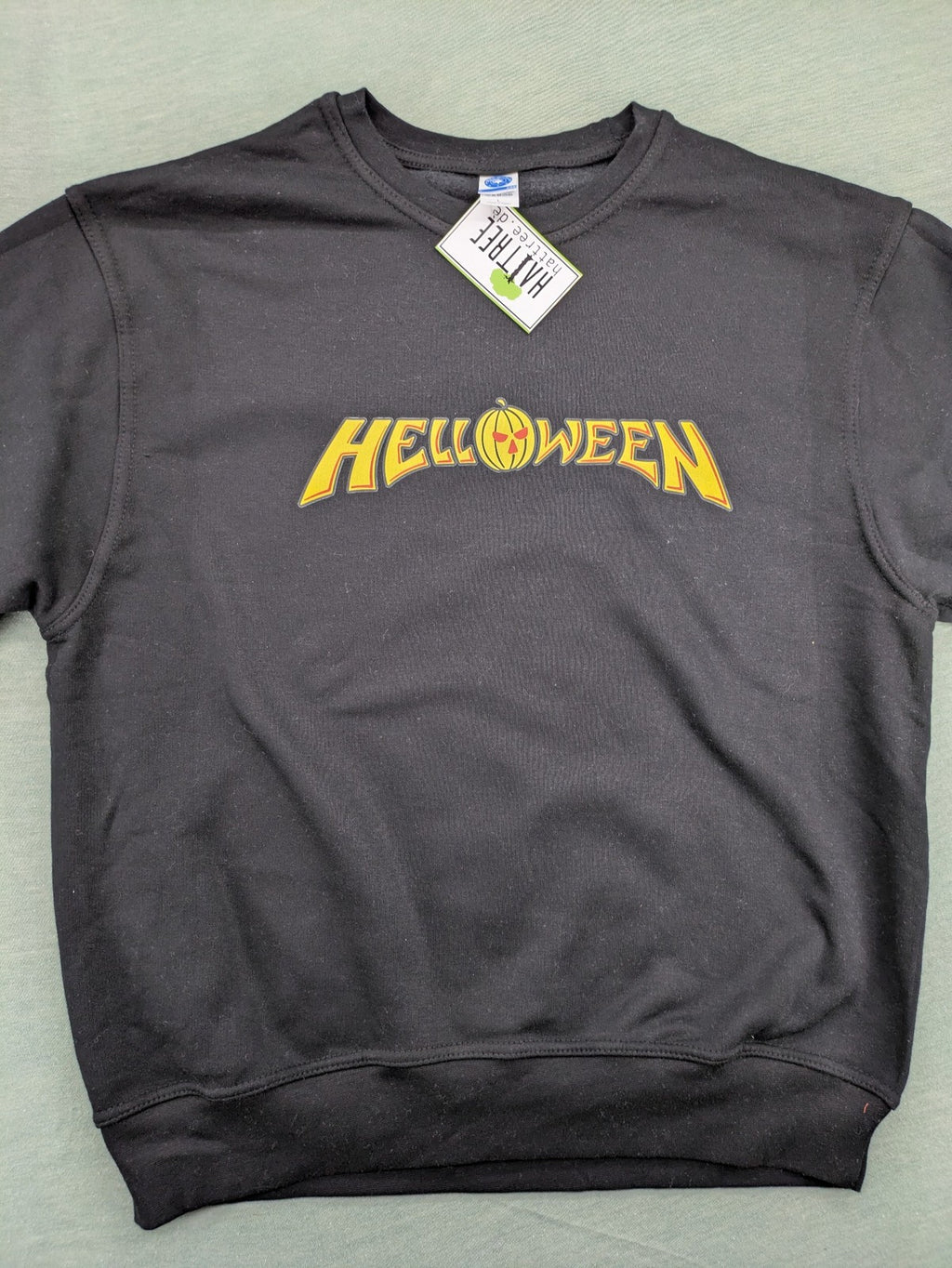 Helloween grey sweatshirt featuring bright yellow pumpkin logo, made from cotton blend.