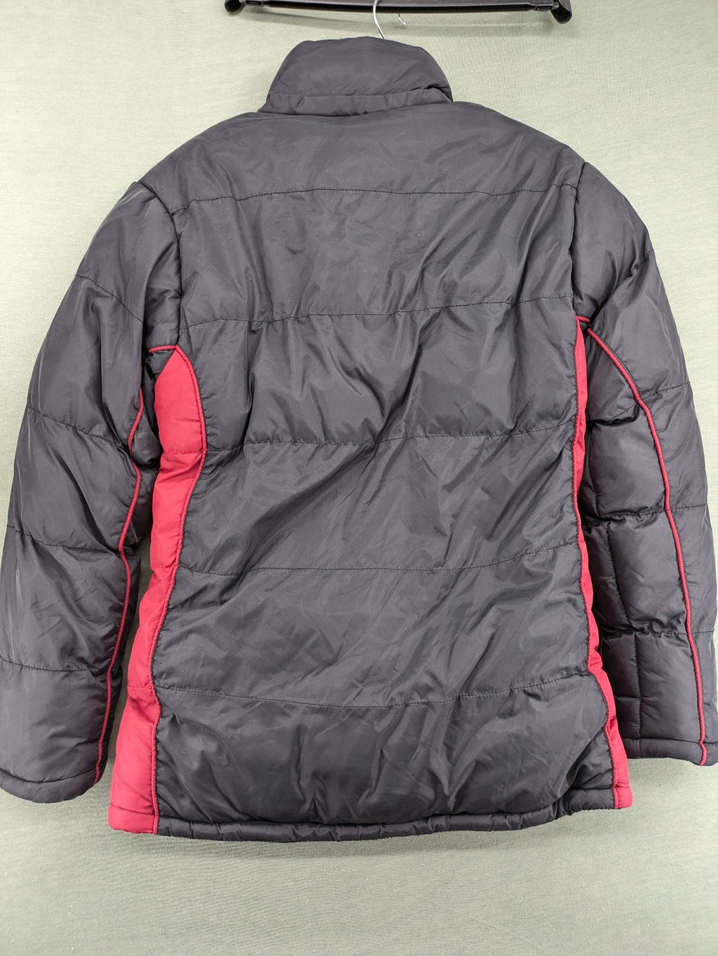 Puffer grey and red jacket with fleece lining, front zipper, and side pockets.
