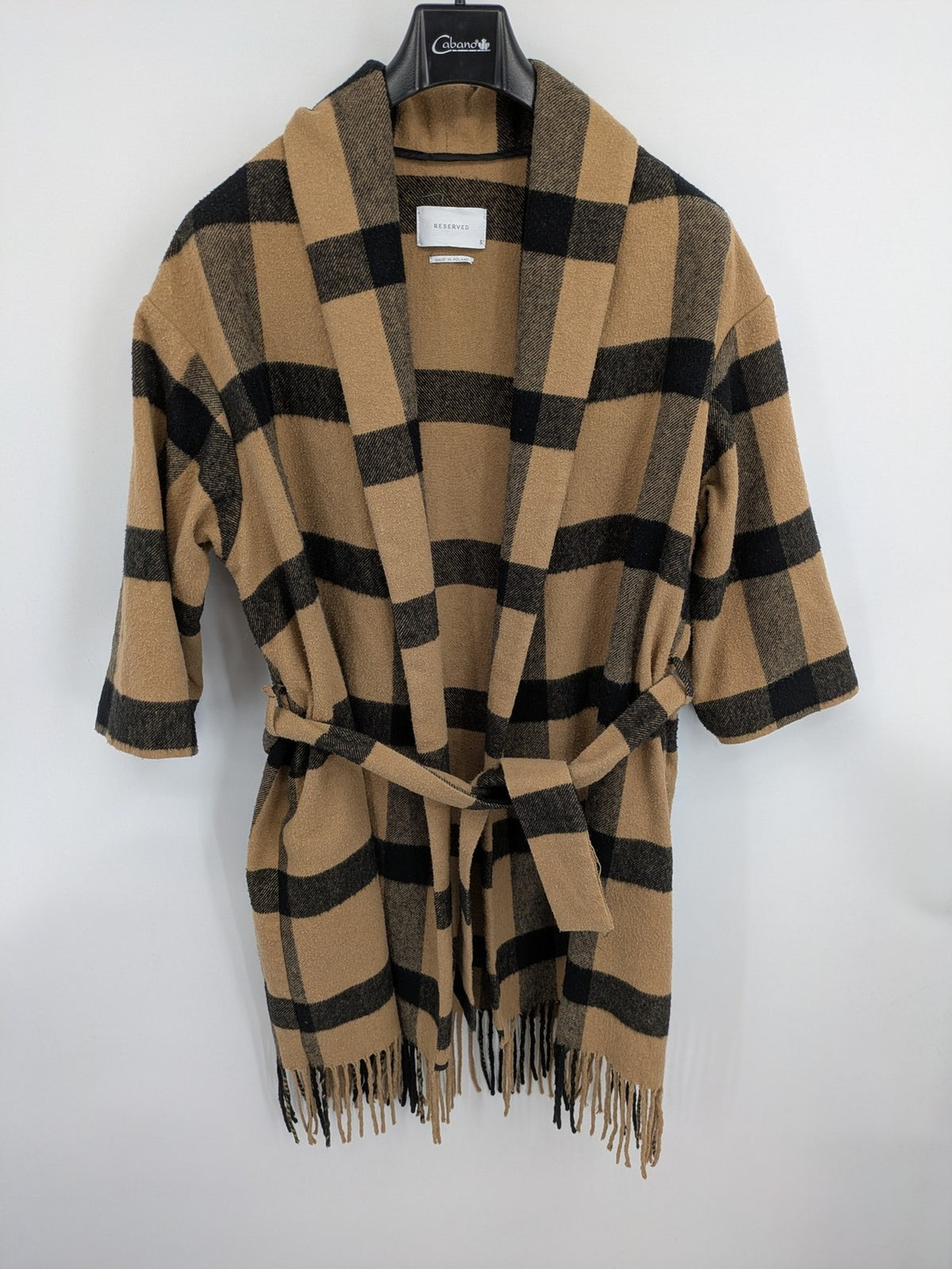Reserved cream coat with brown and black check pattern, fringe hem, wool blend material.