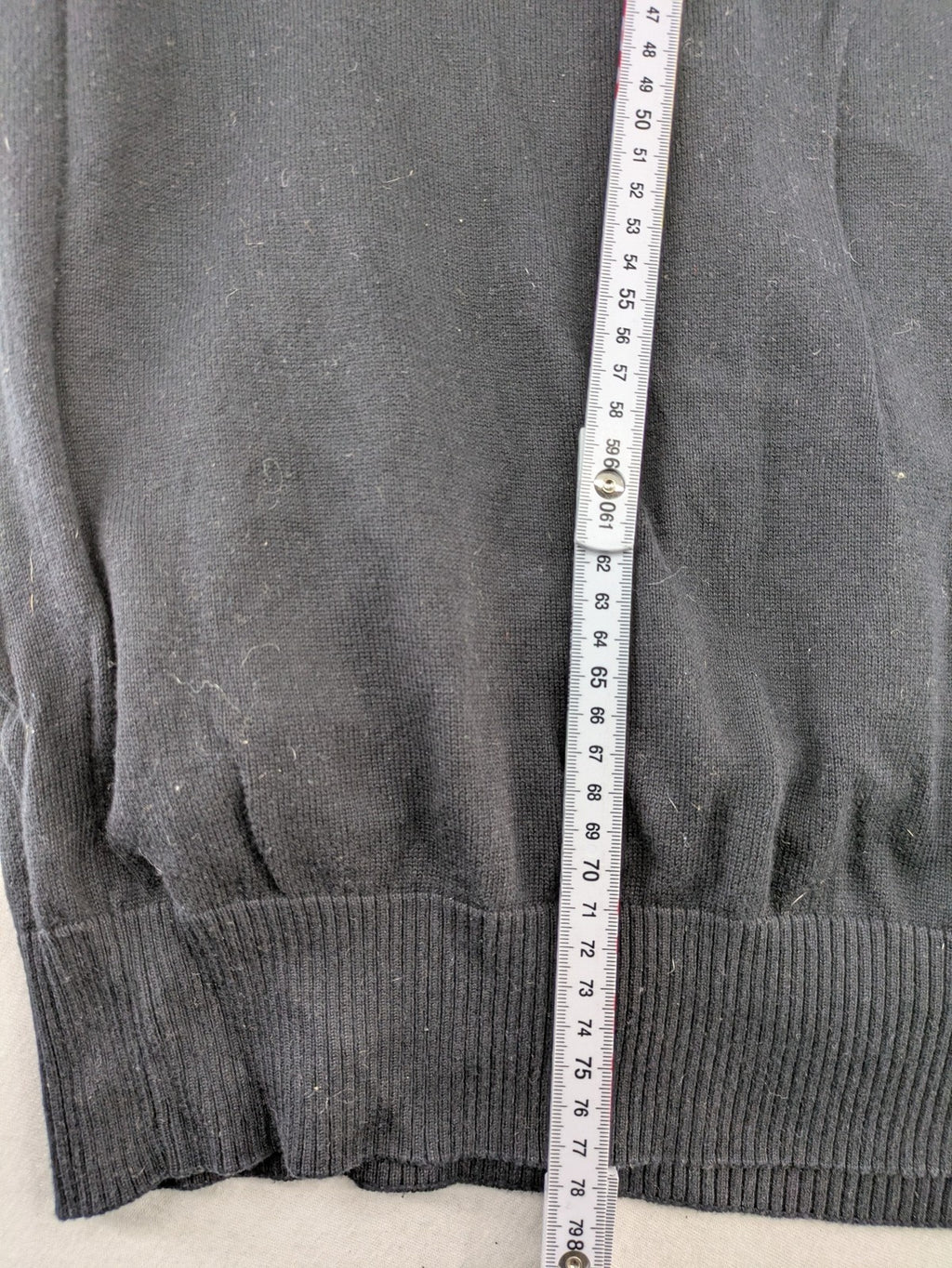 Angelo Litrico black knit jumper V-neck with tonal emblem and "Supreme Oil Quality" graphic.
