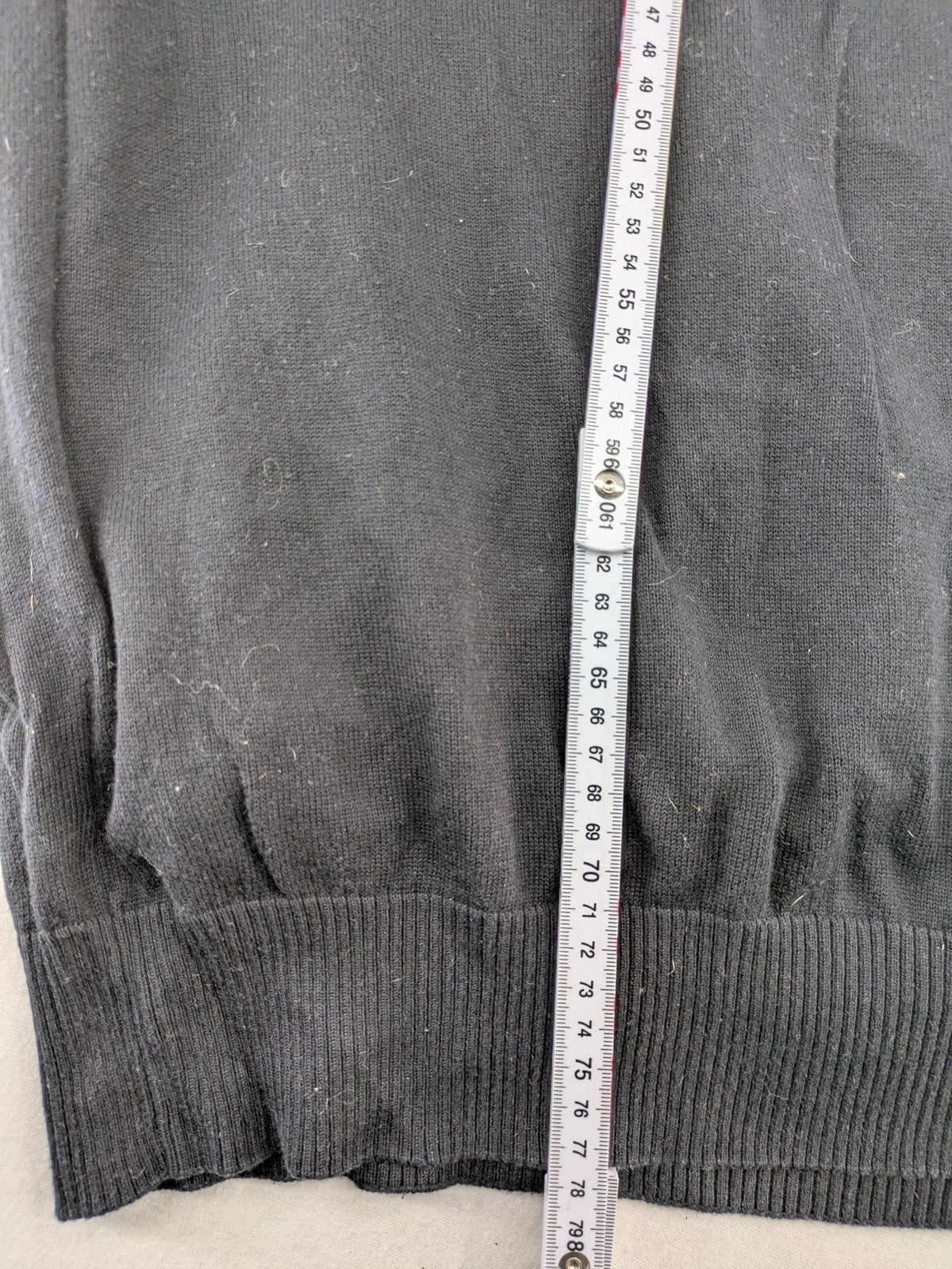 Angelo Litrico black knit jumper V-neck with tonal emblem and "Supreme Oil Quality" graphic.