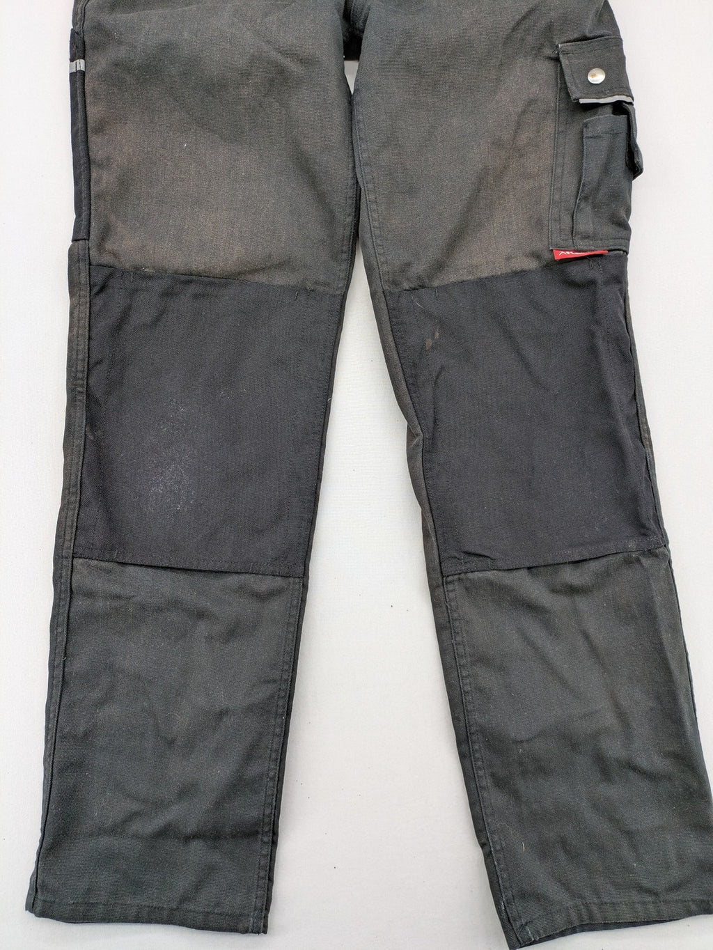 Planam work trousers black canvas with Cordura knee reinforcement and cargo pockets.