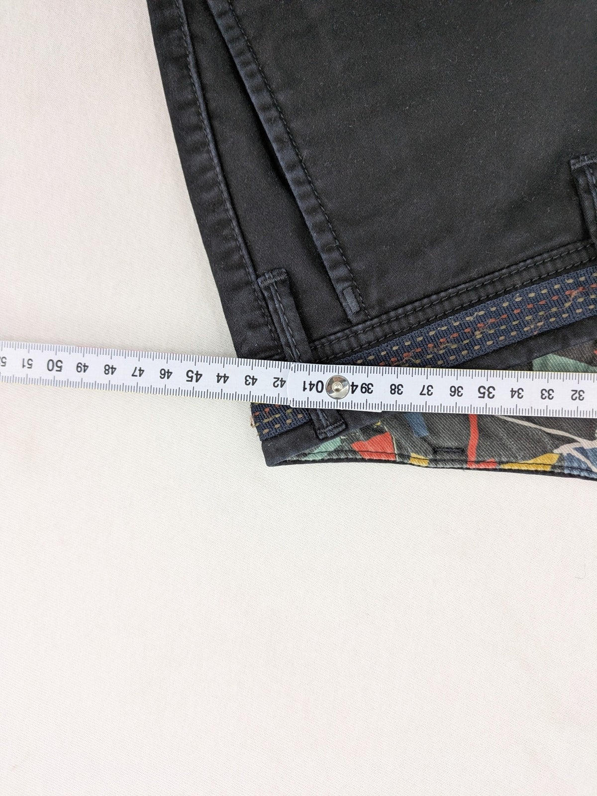 MMX grey chino pants with colorful inner waistband and premium bio-cotton blend.